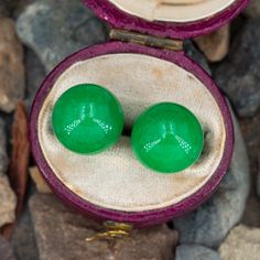 This dyed jade necklace and earring set features a necklace with a single jade bead that slides and jade spheres of the same size for the stud earrings. The chain on the necklace is 18 inches long and the earrings are finished with friction backs for pierced ears. The set is crafted in 14k yellow gold. We have a few sets available. Formal Jade Jewelry With Round Beads, Classic Green Jade Jewelry, Classic Round Jade Jewelry, Fine Jade Jewelry For Formal Occasions, Classic Jade Jewelry For May Birthstone, Formal Round Jade Jewelry, Classic Jade Jewelry With Matching Earrings, Formal Jade Gemstone Jewelry, Formal Jade Jewelry For May Birthstone