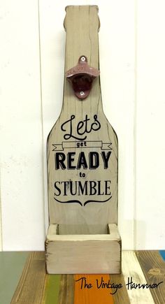 a wooden sign that says let's not ready to stumble