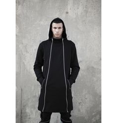 Soft cotton long hoodie with functional zippers on the front side that you can open from both sides. The model on the picture is 185 tall, chest 92, waist 75 and wears size S. For custom orders please add in the personalization square your measurements (height/ chest/ waist) so we can adjust it for you. Normal wash. Collection AW 20/21 'BULLETPROOF' Techwear Long Coat Parka For Streetwear, Techwear Style Long Parka For Streetwear, Long Techwear Parka For Streetwear, Urban Parka With Zipper Closure For Streetwear, Black Hooded Jacket With Zip Cuffs, Hooded Long Sleeve Jacket With Zip Cuffs For Streetwear, Black Hooded Jacket With Zip Cuffs For Streetwear, Techwear Style Parka With Zipper For Streetwear, Long Sleeve Hooded Jacket With Zip Cuffs For Streetwear