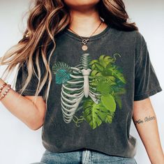 Skeleton Plant Body T-shirt, Plant Lover Shirt, Plant Gift, Plant Lover Gift, Plant Mom, Monstera Tee, Plant Graphic Shirt, Plant Lady Gift 📢Please Check All Photos For Details.   📢Choose Your T-Shirt Size From The Drop-Down Lists Next To The item Picture   📢Choose Of Your T-Shirt Color From The 2nd Picture   📢Use "Add message to Seller" link On The Checkout Page To Send me the Following important Details For Your Order's Customization.   📢Shipping Time Varies by location (we are located in Plant Graphic, Plant Gift, Plant Lover Gift, Plant Mom, Mens Long Sleeve Tee, Plant Lady, Plant Gifts, Tees For Women, Graphic Shirt