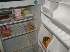 an open refrigerator filled with food and condiments