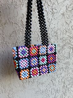 The Granny Square Pearl Bead Bag is completely handmade. I design with natural beads and lovingly. This size is perfect for carrying your keys, cards and wallet. I can produce bags according to your request. Detail Handmade product, Only produced in 1 day, Suitable for daily use I send my cargo free of charge by express shipping. Canada: 3-7 business days United States: 3-7 business days North America: 3-7 business days Europe: 3-7 business days * Materials Crystal beads Crystal Bead Bag, Bead Bag, Square Crystal, Produce Bags, Beaded Bag, Square Bead, Handmade Bag, Beaded Bags, Bag Vintage