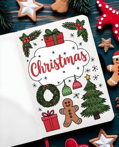 an open christmas coloring book surrounded by decorated cookies and gingerbreads on a table