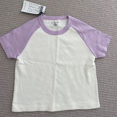 Brandy Melville Purple Sleeve Crop Top Tee Baseball Style Tee Never Worn Nwt 100% Cotton Trendy Purple Everyday Top, Everyday Purple Short Sleeve Tops, Purple Everyday Spring Top, Purple Everyday Spring Tops, Purple Tops For Everyday Spring Wear, Light Purple Tops, Basic White Summer Shirt, White Short Sleeve Basic Tops, White Basic Shirt For Spring