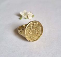 Beautiful solid gold old coin signet ring, vintage-style big round boho jewelry for women, available in 9k or 14k yellow gold.  This handmade gold ring is made by minting a beautiful Swiss coin decorated with flowers and attaching it to a solid gold band. The band features three small dots on each side, adding a unique, vintage character to this jewelry piece. It is available in 9k or 14k solid yellow gold.  This statement ring is exquisite and delicate, with a charmingly romantic and vintage to Antique Coin-shape Engraved Signet Ring, Antique Coin Shaped Engraved Signet Ring, Antique Engraved Coin Signet Ring, Gold Coin-shaped Engraved Ring, Vintage Gold Dome Ring With Engraving, Victorian Style Gold Initial Ring With Round Shape, Vintage Coin Signet Ring As Gift, Vintage Coin Shaped Signet Ring Gift, Vintage Coin Signet Ring For Gift