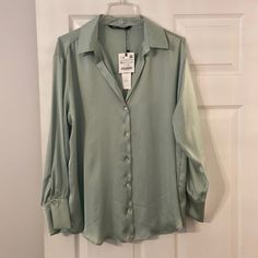 Zara Shirt With Long Sleeve Silky Feeling See All Pictures Brand New With Tag There Is Some Loose Thread On The Back Not Ripped At All But Just Due To Silky Feelings Seems Like Thread Suffered Little Bit Please See All Pictures Beautiful Green Sage Color Length 26” Bust 42” (A2) Zara Long Sleeve Top For Office, Zara Long Sleeve Office Shirt, Green Collared Zara Blouse, Zara Green Collared Blouse, Zara Green Long Sleeve Shirt, Zara Long Sleeve Tops In Solid Colors, Zara Collared Top, Zara Solid Color Blouse For Work, Green Zara Tops For Office