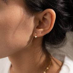 An exquisite pair of tiny pearl and diamond drop stud earrings you'll want to wear indefinitely. Meticulously handcrafted in 925 Sterling silver with a luxurious 18k Gold Plated finish, and adorned with shimmering Cubic Zirconia. Materials & Finish: * High-Quality 925 Sterling Silver * 18k Gold * Cubic Zirconia * Natural Freshwater Pearl Size Specs: * Size: 3mm x 3mm Features: * Waterproof / Hypoallergenic / 100% lead and nickel free / Anti-tarnish * Sold as a pair * Stylish Minimalist Design * Non Tarnish Earrings, Tiny Pearl Earrings, Dainty Everyday Jewelry, Dainty Stud Earrings, Old Money Earrings, Wedding Earrings Simple, Dainty Wedding Earrings, Minimalist Wedding Earrings, Piercing Stack