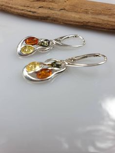 Baltic Amber set. Sterling silver 925 with hallmarks. Multi colour Amber. Nice and not to big set. Earrings length 3,2 cm. Lever back. Free gift - silver plated chain (only when You buy a set or a pendant). More earrings: https://www.etsy.com/shop/AmberLithuania?ref=simple-shop-header-name&listing_id=780205095&section_id=27948198 Silver Clip-on Earrings With Lever Back For Gift, Sterling Silver Earrings With Silver Clasp For Anniversary, Silver Clip-on Earrings With Lever Back As A Gift, Sterling Silver Teardrop Clip-on Earrings As Gift, Teardrop Sterling Silver Clip-on Earrings For Gift, Silver Earrings With Sterling Silver Clasp For Anniversary, Sterling Silver Clasp Earrings For Anniversary, Amber Sterling Silver Earrings, Baltic Amber Jewelry