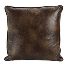 a brown leather pillow on a white background