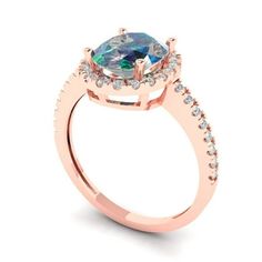 a rose gold engagement ring with an oval blue topazte surrounded by white diamonds