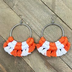 Show your University of Tennessee Team Spirit! This pair of beautiful macrame earrings were hand knotted and fringed at the edges with orange and white cotton cord.  These are very lightweight to wear and have nickel free stainless steel plated earring wires. Each round shaped earring is 2 1/2 inches long and about 2 1/2 inches wide.  Be sure to check out the rest of my micro-macrame jewelry in the shop! Large Statement Earrings, Earring Wires, Macrame Earrings, Spring Hill, Stainless Steel Plate, University Of Tennessee, Earrings Large, Micro Macrame, Macrame Jewelry