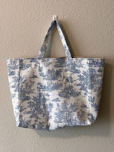 Welcome to my handmade shop! Lovely French style fabric, Toile de Jouy tote bag with various colors.   high quality of Linen and gorgers patterns. Pretty large size so you can put many stuffs! Also it can be a really good for the travel or beach bag! There are two pockets inside the bag. *Fabric details.  -Pink color only a 100% Cotton and the others are 100% Linen -Self fabric handles  -It can be various patterns depending on the cut *Size -Length  S -  13*12*4 inch  / 33*31*12cm M-  14*13*5 in Fabric Tote Shoulder Bag For Vacation, Rectangular Fabric Vacation Bag, Vintage Cotton Travel Bag, Vintage Handmade Tote Beach Bag, Handmade Travel Canvas Tote Bag, Handmade Canvas Tote Bag For Travel, Vintage Tote Beach Bag For Travel, Square Cotton Beach Bag For Travel, Vintage Everyday Fabric Bag