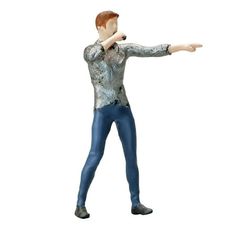 a statue of a man in blue pants and a silver shirt pointing at something with his right hand