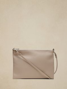 Behold: the perfect carry-it-everywhere bag in a not-too-big size.  Crafted in soft leather, this bag has a fully detachable shoulder strap so you can wear it crossbody, on your shoulder, or carry it as a clutch.  Zip top closure.  Interior slip pock Versatile Clutch Shoulder Bag For On-the-go, On-the-go Clutch Shoulder Bag With Detachable Handle, On-the-go Crossbody Clutch With Detachable Strap, Versatile Soft Leather Clutch Bag, Versatile Clutch With Detachable Strap For Daily Use, Versatile Soft Leather Clutch Satchel, Versatile Clutch With Detachable Strap In Satchel Shape, Everyday Satchel Clutch With Detachable Strap, Leather Clutch With Adjustable Strap