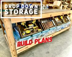 a wooden table with tools on it and the words build plans above it that says drop down storage