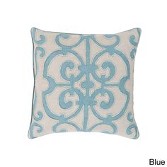 a light blue and white pillow with an intricate design on the front, in a square shape