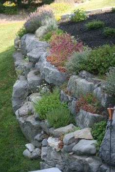 there is a rock wall in the yard