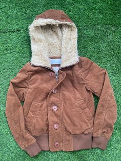 Vintage Sunao Kuwahara by Issey Miyake Corduroy Sherpa Hoodie Jacket Condition : 9/10 MEASUREMENT : Tag Size: S Armpit to armpit: 17.5 inch (45 CM) Shoulder to bottom hem: 21.5 inch (55 CM) PLEASE CHECK ACTUAL SIZE CAREFULLY, NO RETURNS OR COMPLAIN FOR WRONG SIZE ACTUAL ●All Measurements were been measured flat on the floor. ●Please don't expect this item condition is 100% like new unless I have mention it. ●Please Dont worry about Custom tax fees during Shipping because I always declared all it Winter Cotton Hooded Jacket, Brown Hooded Jacket With Detachable Hood For Winter, Cotton Outerwear For Winter Streetwear, Cotton Winter Outerwear For Streetwear, Cotton Hooded Winter Jacket For Cold Weather, Winter Cotton Outerwear With Ribbed Cuffs, Hooded Cotton Parka With Fleece Lining, Hooded Cotton Outerwear For Fall, Winter Cotton Parka With Double-lined Hood