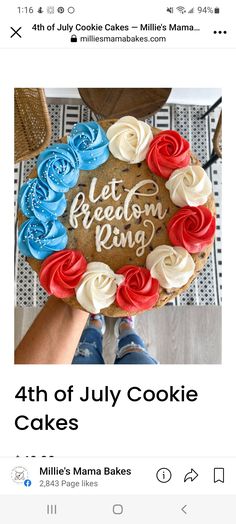 someone holding up a cake with red, white and blue frosting