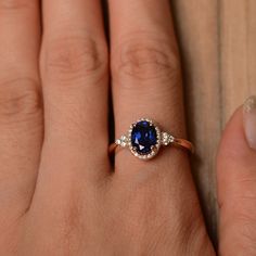 It is a (lab sapphire) ring. The main stone is (6 mm*8 mm oval cut).weight about (1.75) carats. The basic metal is sterling silver and plated with rhodium/14k white gold/14k rose gold/14k yellow gold You can also go to my shop Home for more elegant rings: https://www.etsy.com/shop/godjewelry?ref=hdr_shop_menu Customization is always welcome and please feel free to contact with me if you have any design ideas! Oval Lab-created Sapphire Jewelry With Halo Design, Classic Oval Rose Gold Sapphire Ring, Dainty Oval Sapphire Ring For Formal Occasions, Dainty Oval Sapphire Ring For Anniversary, Sapphire Engagement Ring Emerald Cut, September Birthstone Ring, Oval Sapphire Ring, September Birthstone Rings, Blue Gemstone Rings