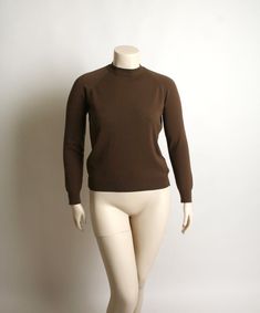 "FREE DOMESTIC SHIPPING! ♥ Lovely vintage 1970s chocolate brown blouse top! ♥ Back nylon zipper, long sleeves. Unique stitch details at the shoulders. ♥ In great condition! Designers Originals, action knit tag. Has a good stretch to it. Antron nylon. * measurements * Bust - 46\" Shoulders - 14\" Waist - 38\" Sleeve length - 24\" Length - 24\" Best fit a large! Does have a little extra stretch! ** I do ship worldwide! For more vintage cuteness, check out my store: → http://zwzzy.etsy.com ← ❀ Inst 1970s Blouse, Brown Blouse, Floral Print Tunic, Pink Tunic, Brown Long Sleeve, Vintage 1950s Dresses, Pink Cotton Candy, Pink Maxi Dress, Long Puff Sleeves