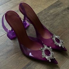 An Italian-Made Pump For The Most Glam Of Cinderellas Gets Its Ethereal Look From A Clear Upper Crowned With An Opulent Jeweled Ring. Amina Muaddi's Kick-Flare Heel Is The Signature Finish. Elegant Purple Slingback Heels, Purple Slingback Heels For Formal Occasions, Purple Slingback Pumps With Heel Strap For Party, Purple Slingback Pumps For Party, Elegant Purple Slingback Pumps, Muaddi Shoes, Amina Muaddi Heels, Amina Muaddi Shoes, Purple High Heels