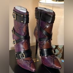 Nib Scene Women's Corsia Faux Leather Purple And Black Snake Skin Stiletto Boots. Size 5.5 These Beautiful Stilettos Are A Great Way To Spice Up Your Wardrobe! Features Faux Leather Straps The Wrap Around And Secure With Gold Tone Buckles, Inside Zip For Easy On And Off. Slight Peeling On Left Shoe On Top Inside Strap Near Zip And Bottom Inside Strap. Flaws Shown In Pictures. Night Out Faux Leather Heeled Boots With Buckle Closure, Black Knee Length Boots, Black Wedge Booties, Black Snake Skin, Purple Snake, Leopard Boots, Knee Length Boots, Knee High Heels, High Heel Boots Knee