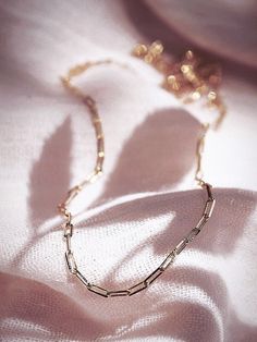 A dainty new classic, the Kala'i Paperclip Chain Necklace is a stunning addition to your collection. Made from 18kt Gold Filled, this popular paper clip style chain is versatile, elegant necklace is a striking statement worn alone or with a bevy of other beauties. ✦ DETAILS ✦ ✧ Name: Kei (KEH ee) - One's pride and glory. ✧ You will receive one necklace. ✧ Links measure 2mm x 5.5mm each. ✧ 18kt Gold Filled with a spring clasp. ✧ All Ke Aloha Jewelry pieces come packaged thoughtfully, beautifully, Elegant Chain Necklace With Rectangular Links As Gift, Elegant Everyday Charm Necklaces With Paperclip Chain, Elegant Rectangular Links Necklace For Gifts, Classic Rose Gold Necklace With Gold Chain, Classic Rose Gold Necklace, Minimalist Jewelry With Rectangular Link Clavicle Chain, Elegant Paperclip Charm Necklaces For Everyday, Delicate 14k Gold Filled Paperclip Chain Jewelry, Delicate 14k Gold-filled Paperclip Chain Jewelry