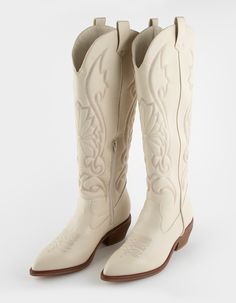 Mia Kolt Tall Western Boots. Take Your Boot Collection To New Heights With Kolt. Embroidered Details. Zip Closure On Sides. Approximate Shaft Height: 17.5". Approximate Heel Height: 2.5". Pointed Toe. Vegan Leather Upper. Synthetic Sole. Imported. Light Cowboy Boots Outfit, Cream Cowboy Boots Outfit, Cowboy Boots Outfit Winter, Tall Western Boots, Cowboy Boots Outfit, Tall Western Boot, White Cowgirl Boots, Winter Boots Outfits, Boot Collection