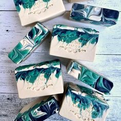 five soap bars with blue and white designs on them