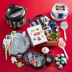 star wars themed items are laid out on a red surface with utensils and other accessories