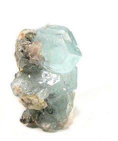 MUN05-2 Aquamarine Mt. Xuebaoding, Ping Wu, Sichuan Province, China Cabinet, 9.6 x 6.3 x 6.3 cm This is the first of two unusual Chinese aqua specimen I obtained in a freak lot of such cherrypicked, showy oddities that I was extremely happy to get ahold of. The large crystal, for scale, is about 2 inches (5 cm)  across. I will say up front that most Chinese aquas do not appeal to me, as they tend to be pale to begin with and then flattishly laying about upon matrix, and thus lack the pizzazz... Jedi Exile, Art Book Cover, Sichuan Province, Crystal Aesthetic, Antique Bottles, Vintage Bottles, Large Crystal, Aquamarine Crystal