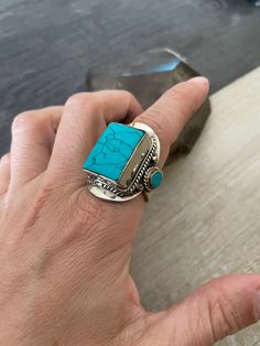 Big square statement ring, made with alloy metal and Turquoise. The perfect big ring to wear with your everyday outfit, its super comfy to wear. It comes in different sizes, check the sizes available in the drop down window. The rings are 1.10 inch- 2.7cm long The stone is- 0.75inch- 1.9cm long 0.60- 1.5cm wide. A most have addition to your jewelry collection. ⚡️GET 20% OFF NOW⚡️ JOIN AKASHI'S VIP LIST and Shop ⚡️Join Akashi's VIP list for early bird discount access⚡️ Paste into your browser htt Nickel-free Turquoise Metal Rings, Unique Rectangular Turquoise Ring, Handmade Turquoise Rectangular Rings, Turquoise Metal Rings As A Gift, Turquoise Rings Suitable As Gifts, Turquoise Metal Rings For Gifts, Turquoise Metal Rings For Gift, Bohemian Silver Rectangular Ring, Blue Turquoise Ring Perfect As Gift