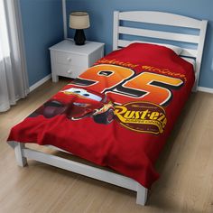 this is a bed with cars printed on it