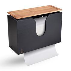 a black tissue dispenser with a wooden top and white paper on it