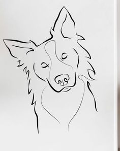 a black and white drawing of a dog's face on a refrigerator freezer