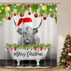 a christmas themed shower curtain with a cow wearing a santa hat in a bathtub