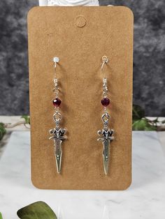 Handmade by Jennifer Nicole. French hooks are .925 sterling silver the rest of the earring is not.  Red beads are made of glass. Red Sterling Silver Pierced Earrings, Red Sterling Silver Earrings For Pierced Ears, Nickel-free Red Drop Earrings Jewelry, Red Sterling Silver Dangle Jewelry, Red Sterling Silver Drop Earrings, Pierced Sterling Silver Drop Crystal Earrings, Red Pierced Drop Earrings, Red Nickel-free Sterling Silver Jewelry, Nickel-free Red Sterling Silver Jewelry