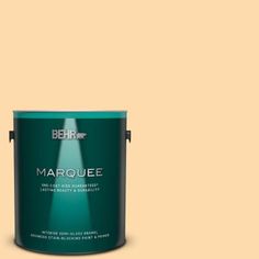 the behr marquee paint is shown in an open, dark green color