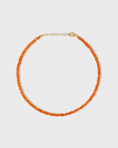 Vibrant orange carnelian crystal beads hand strung in the heart of New York City and finished with 14 karat yellow gold. 14 Karat Yellow Gold carnelian, 16 carats 9 to 10 inches length 3mm bead size Style # JJ-AAZ-106 UPC 810109744664 Orange Rondelle Jewelry For Gift, Orange Carnelian Round Bead Jewelry, Orange Carnelian Beaded Necklace For Gift, Orange Rondelle Necklace As A Gift, Orange Rondelle Necklaces As A Gift, Orange Rondelle Necklace As Gift, Hand-strung Orange Carnelian Beaded Necklaces, Hand-strung Orange Carnelian Necklaces, Orange Carnelian Hand-strung Necklace