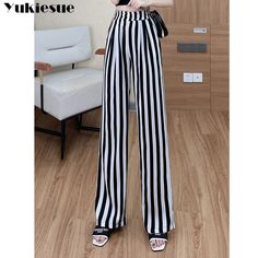 Shipping: Worldwide Express Shipping AvailableDelivery time: 7-15Days Fast ShippingReturns: Fast refund, 100% Money Back Guarantee.Brand Name: YUKIESUEStyle: CasualAge: 25-34Origin: Mainland ChinaCN: GuangdongWaist Type: HIGHElasticity: Slight StrechFabric Type: BroadclothPattern Type: stripedPant Style: Wide Leg PantsMaterial: PolyesterFit Type: RegularLength: Full LengthSeason: Spring/SummerPlace Of Origin: China (Mainland)Closure Type: Elastic WaistGender: WOMENModel Number: 2227Front Style: White High Waist Bottoms With Vertical Stripes, High Waist White Bottoms With Vertical Stripes, Black High-waisted Bottoms With Vertical Stripes, High Waist White Pants With Vertical Stripes, Trendy White Striped Pants, Trendy White Pants With Vertical Stripes, Black Pants With Vertical Stripes For Summer, Trendy Black Bottoms With Vertical Stripes, Loose Trousers Women