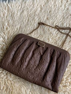 "Evening purse, ostrich leather purse, brown gold handbag, vintage leather purse, clutch,gift for her, wife, girlfriend, mother, gift ideas, This gorgeous ostrich leather purse is in pristine condition.  This is finely made and is luxurious to the touch. It has a beautiful tight clasp. Size 10\" x 7\" Strap length 34\"" Textured Leather Brown Clutch Shoulder Bag, Elegant Brown Textured Leather Clutch, Vintage Brown Pouch Evening Bag, Chic Brown Clutch Evening Bag, Vintage Brown Evening Bag As Gift, Brown Textured Leather Clutch, Formal Brown Textured Leather Clutch, Chic Brown Evening Bag For Gift, Chic Brown Evening Bag As Gift