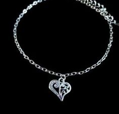 New Handmade Scroll Heart Anklet ~ Stainless steel anklet chain and charm will not tarnish ~ Scroll heart charm ~ Available in 8.5, 9.5 or 10.5 inch length ~ Includes a 2 inch extender ~ Hypoallergenic, Nickle free ~ Ships within 24 hours of purchase Monday-Saturday Gift Packaging & Messages: Your item will be lovingly packaged and labeled as a handmade item.  Item's that ship with gift boxes are stated in the description. Handwritten gift notes available, just include a gift message with your o Adjustable Heart Metal Anklets, Adjustable Heart-shaped Metal Anklet, Heart-shaped Metal Anklets As Gift, Heart-shaped Metal Anklets For Gift, Silver Adjustable Heart-shaped Anklets, Adjustable Silver Heart Anklets, Adjustable Heart-shaped Anklets For Valentine's Day, Casual Silver Anklets As Gift, Casual Silver Anklets For Gifting