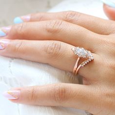 a woman's hand with two rings on it