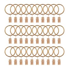 six pairs of gold colored metal rings with wooden tags hanging from each end and two rows of