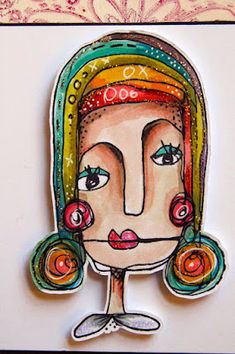 a woman's face with colorful hair and earrings on her head is shown in this handmade card