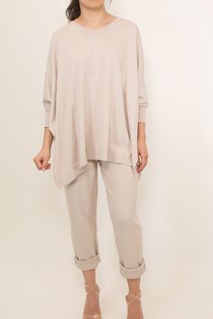 This pullover style goes on easily but is irresistible to take off. Wear it as a refined oversized cozy poncho. This pure Pima Cotton soft V-neck features, side vents, and a delicate knit trim on a carefree, airy silhouette. Perfect for any occasion, from lounging at home to out and about. Looks fabulous layered over a Pima muscle tank. Pair the Irina with the Sicily Pencil Skirt in the same gorgeous stretch cotton and matching color to complete the look. Shop the entire Stretch Knit Pima Cotton New Launch, Out And About, Muscle Tank, Muscle Tanks, Pima Cotton, Sicily, Stretch Cotton, Pullover Styling, Fabric Color