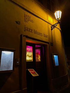 a jazz bar is lit up at night