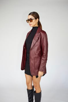 Express yourself in this stunning burgundy 90's inspired leather blazer. A staple blazer that can be worn dressed up or dressed down for all occasions year after year. Genuine sheepskin leather. Model is 5'8/119lbs wearing size small. Vintage 90s Leather Jacket, Red Leather Blazer Outfit Aesthetic, Burgundy Leather Jacket Outfit Women, Burgundy Leather Blazer Outfit, Vintage Leather Blazer, Burgundy Leather Blazer, Burgundy Leather Coat, Maroon Blazer Outfits For Women, Vintage Red Leather Jacket