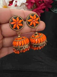 Complete your look this festive season with our lightweight and colorful chandelier jhumka earrings in orange color and antique polish! A gorgeous pair of jhumka earrings to light up your day any time! In stock and ready to ship. Color : orange Note :Color, shades, texture displayed may slightly vary from the actual product due to digital image limitations. We request you to consider these minor variations. Please expect the possibility of some slight imperfections when buying handmade jewelry. Orange Earrings Indian, Small Jhumka, Colorful Chandelier, Pakistani Earrings, Earrings Kundan, Navratri Collection, Terracotta Earrings, Jewelry Pakistani, Wearing Jewelry